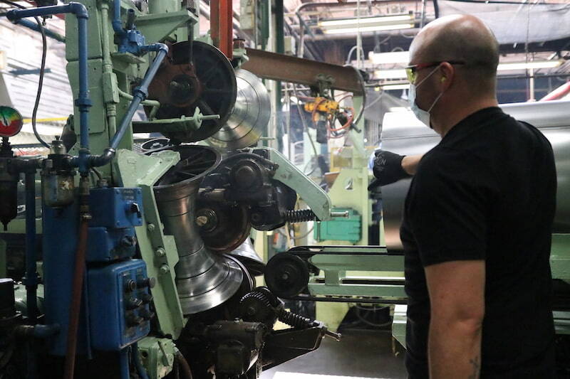 NCC employee manufacturing steel drums